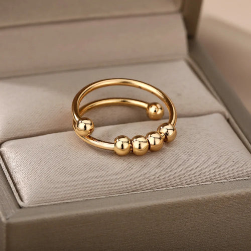 Anillo Anti-Estrés con Perlas Giratorias en oro