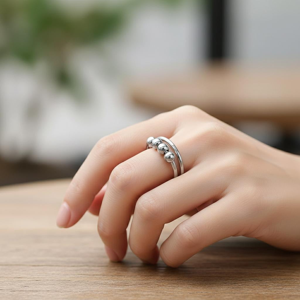 Anillo Antiestrés con Perlas Giratorias