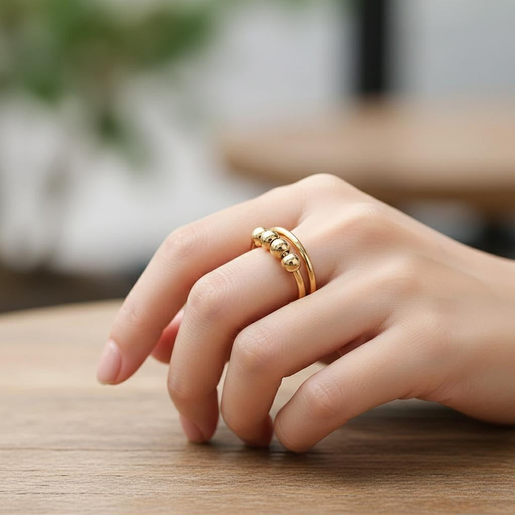 Anillo Antiestrés con Perlas Giratorias