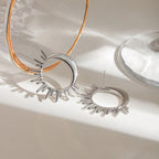 Aretes de botón con media luna y sol en plata
