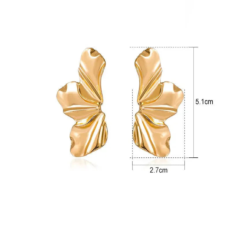 Aretes de botón media flor en oro