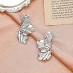 Aretes de botón media flor en plata