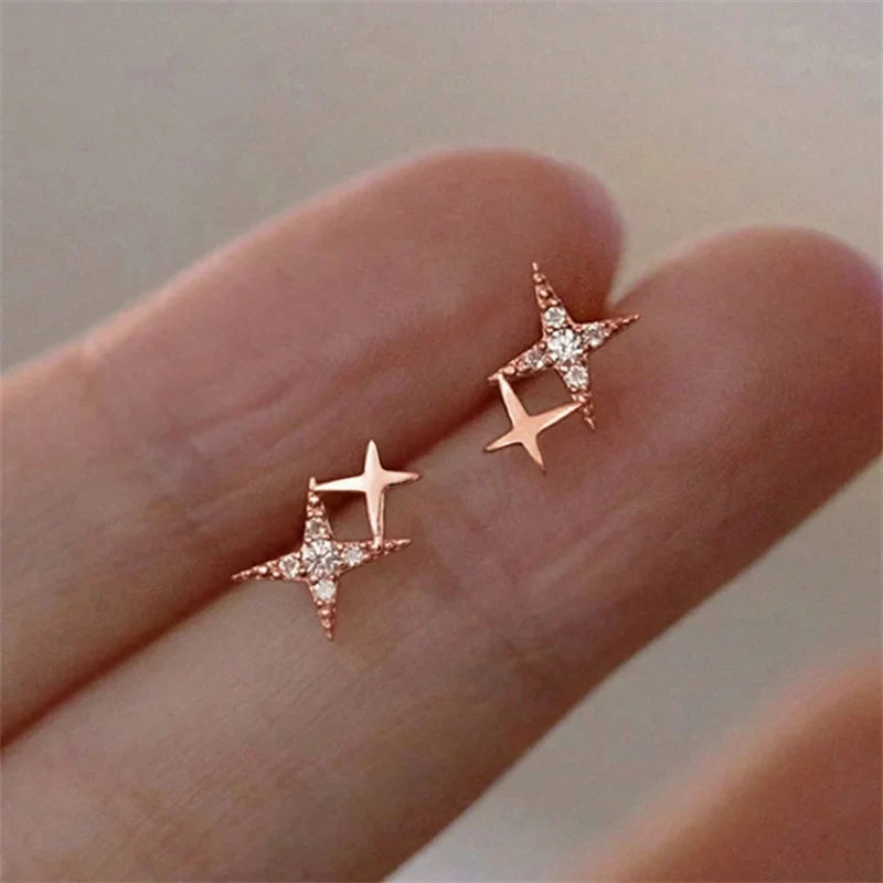 Aretes de Doble Estrella con Circonita en Oro Rosa