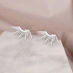 Aretes de botón en media luna Sol plata