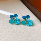 Aretes de botón con flores y perlas azules 1