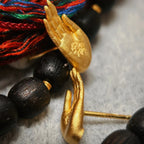 Aretes de Botón Mano de Buda en Oro