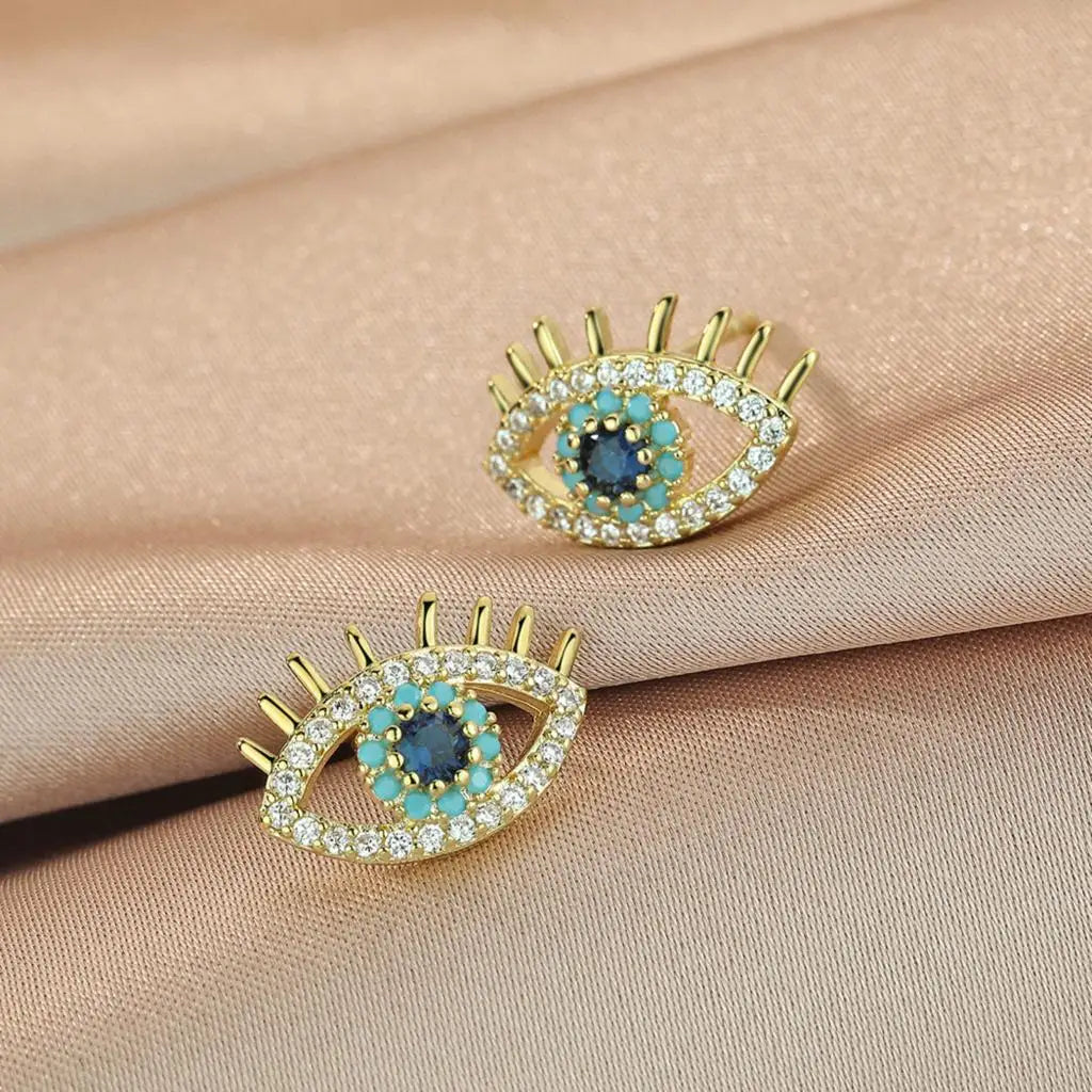 Pendientes de botón con ojo azul y strass