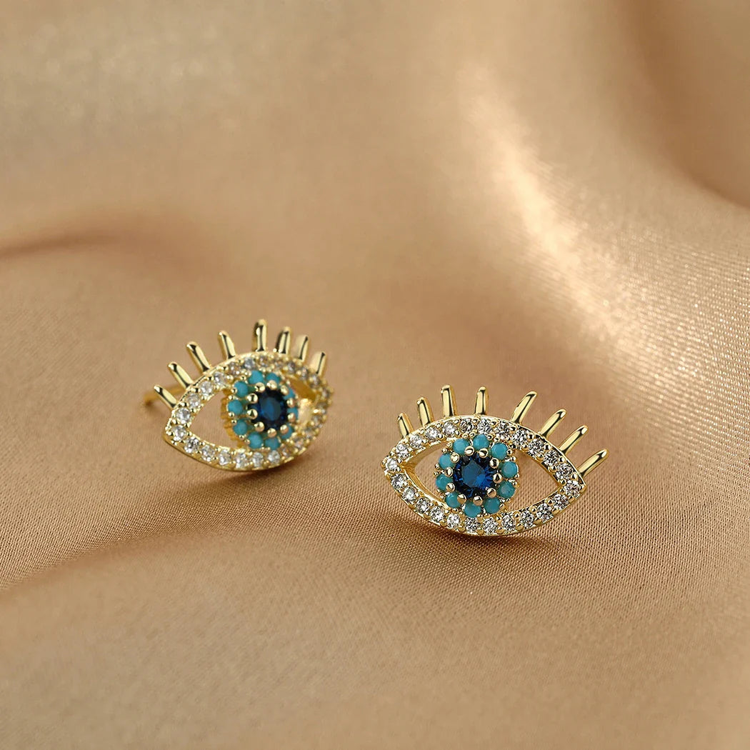 Pendientes de botón con ojo azul y strass