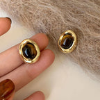 Aretes de Botón Ovalados Ojo de Tigre