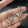 Aretes de Aro Doble Estrella