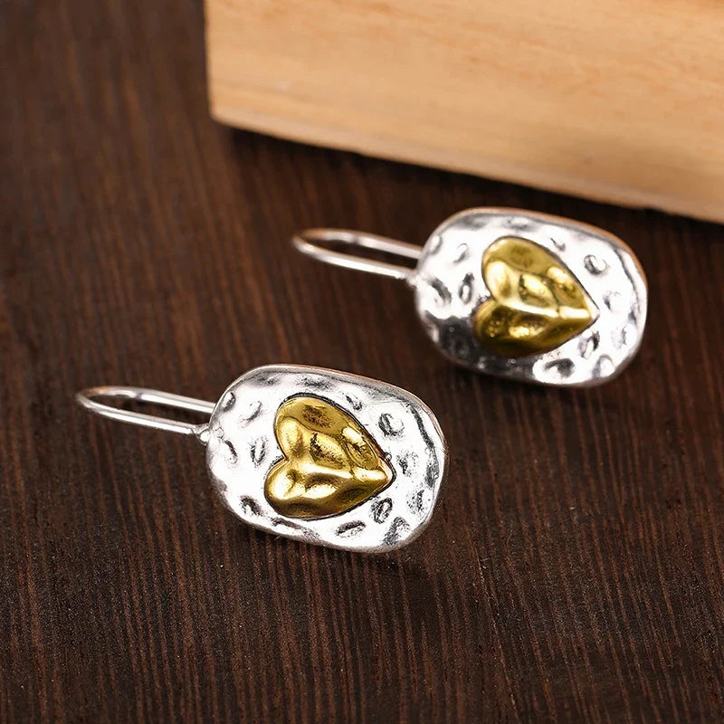 Pendientes de corazón en color plata y oro 