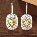 Heart-shaped earrings in silver and gold tones