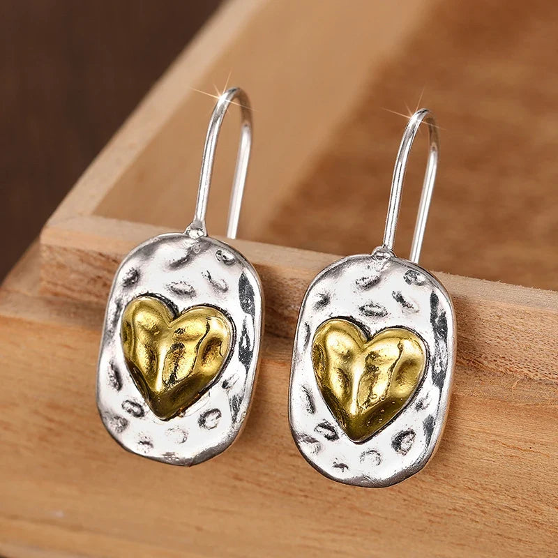 Pendientes de corazón en color plata y oro 