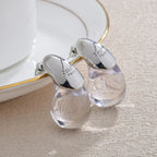 Aretes de botón gota de agua transparente en plata