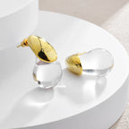 Aretes de botón gota de agua transparente en oro