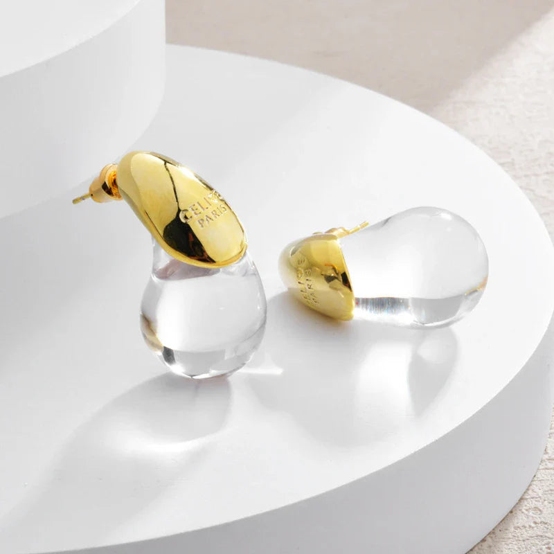 Aretes de botón gota de agua transparente en oro