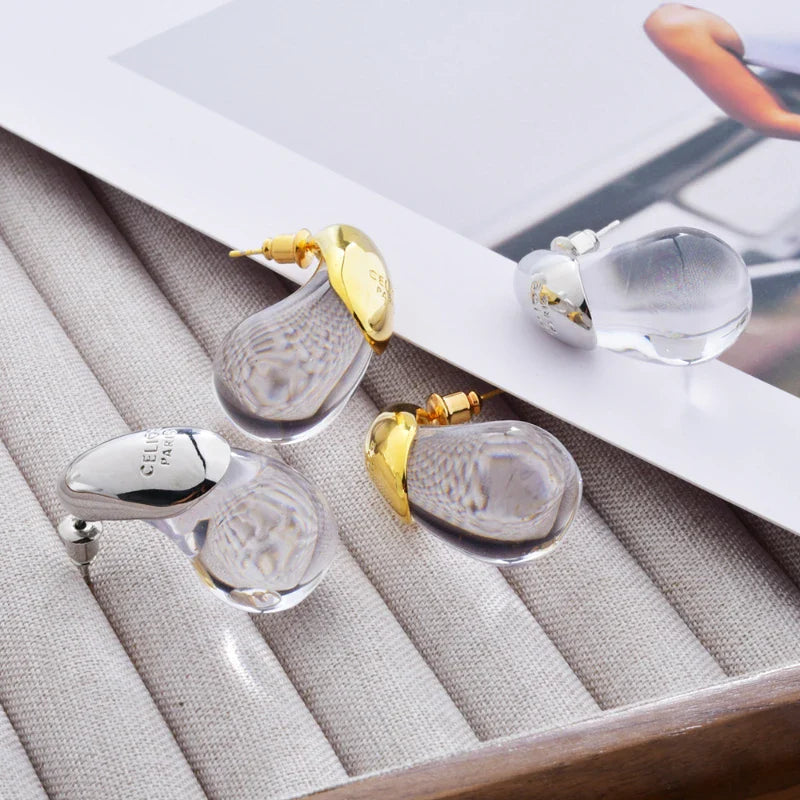 Aretes de botón gota de agua transparente en oro