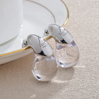 Aretes de botón gota de agua transparente en plata