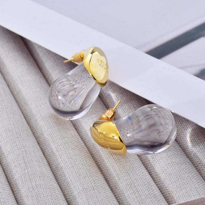 Aretes de botón gota de agua transparente en oro