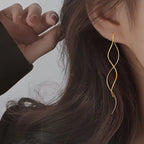 Aretes largos de plata o de oro