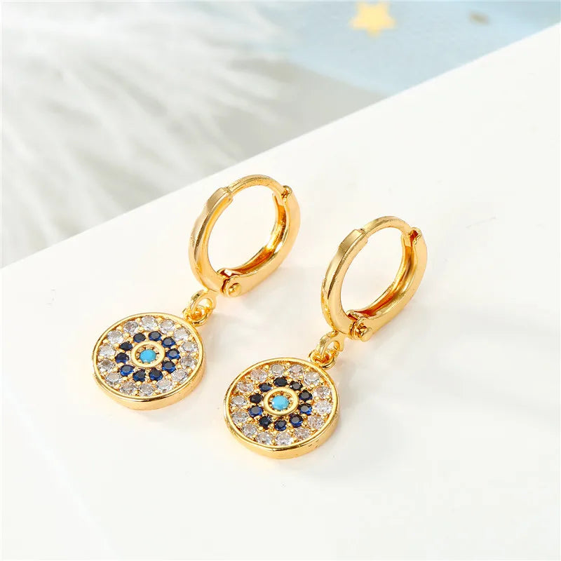 Aretes Ojo Turco Azul con Strass Redondos en Oro
