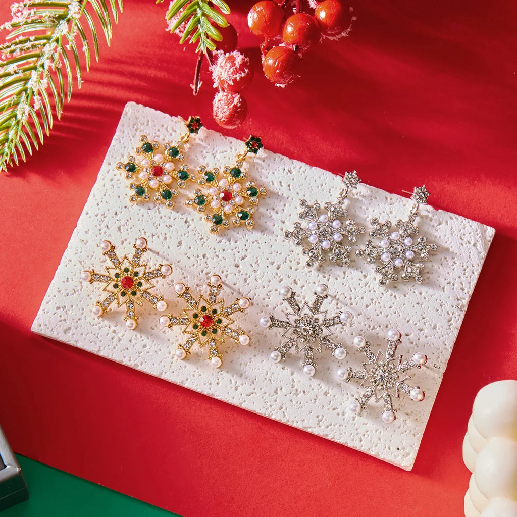 Aretes Colgantes con Copo de Nieve