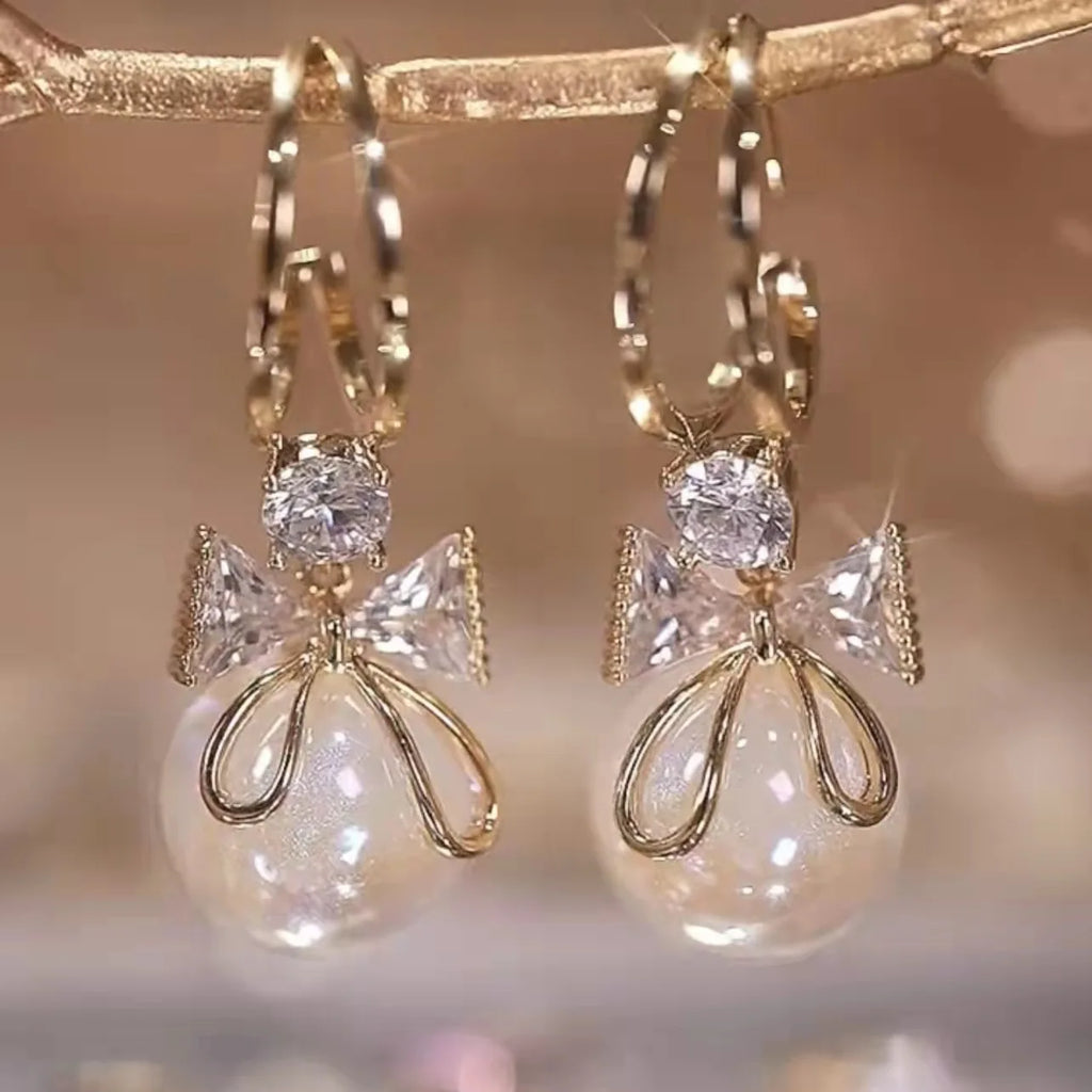 Pendientes Colgantes con Lazo de Mariposa y Perla
