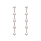 Aretes Colgantes con Perlas Blancas