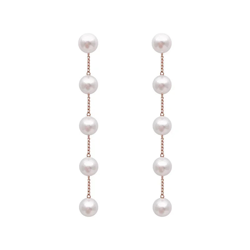 Aretes Colgantes con Perlas Blancas