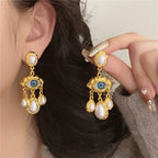 Pendientes Colgantes Ojo Azul y Perlas en oro