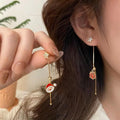 Aretes Papá Noel y Regalo