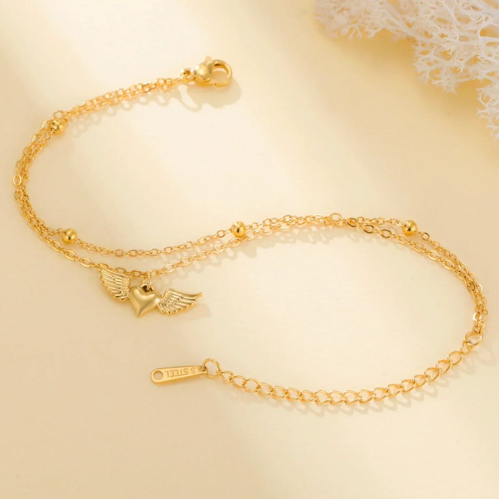 Brazalete ajustable alas de ángel oro