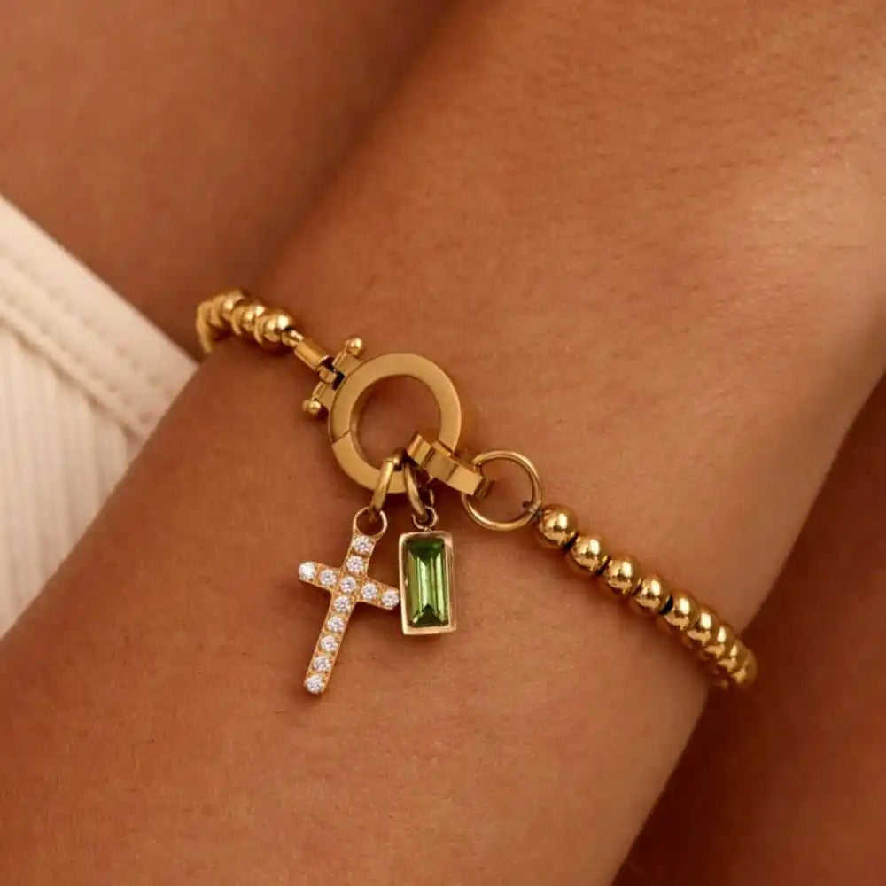 Pulsera con cruz y piedra natal de diciembre