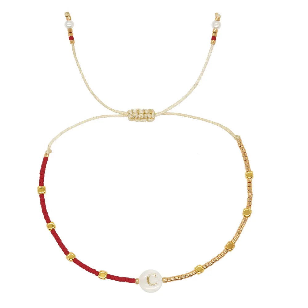 Pulsera bicolor con inicial c