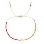 Pulsera bicolor con inicial g