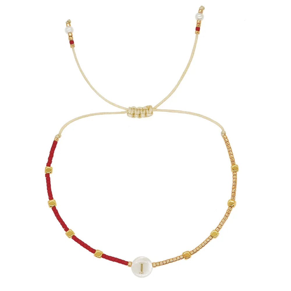 Pulsera bicolor con inicial i