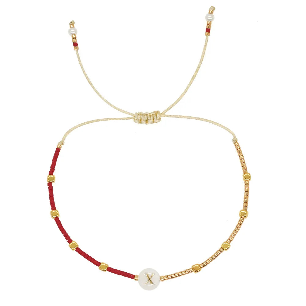Pulsera bicolor con inicial x