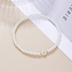 Pulsera blanca inicial u