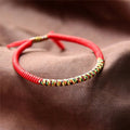 Pulsera de la Suerte Tibetana en Algodón rojo