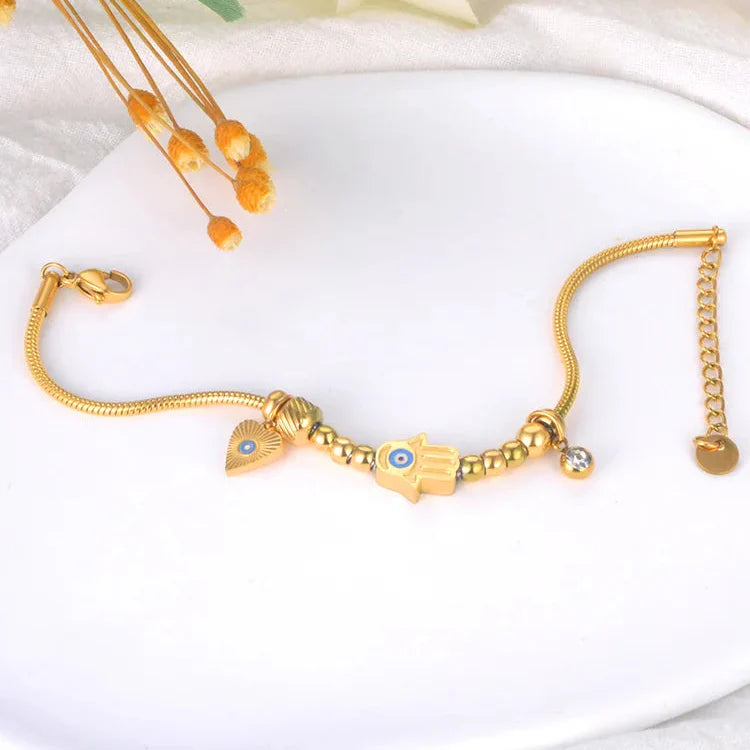 Pulsera de Protección con Mano de Fátima y Ojo Azul en oro