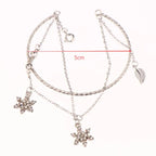 Pulsera doble con copos de nieve de cristal