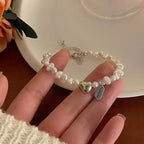 Pulsera Gourmette para Mujer en Perlas con Corazón
