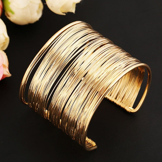 Brazalete rígido grueso de oro y plata para mujer oro