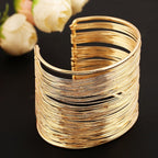 Brazalete rígido grueso de oro y plata para mujer oro