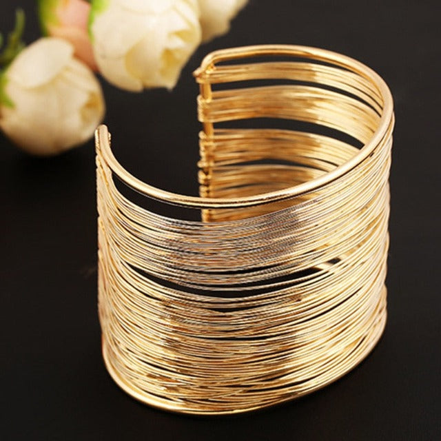 Brazalete rígido grueso de oro y plata para mujer oro
