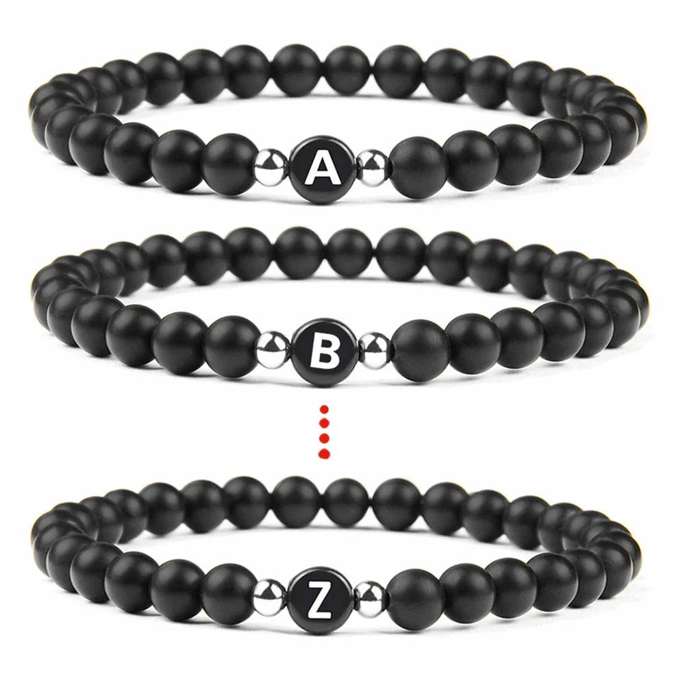 Pulsera negra inicial