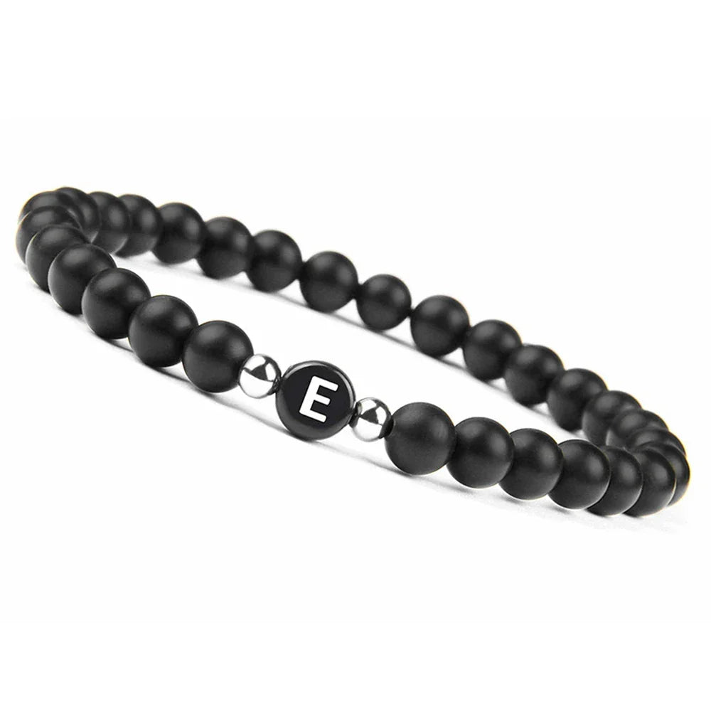 Pulsera negra inicial e