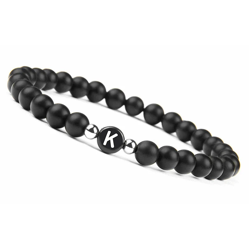 Pulsera negra inicial k