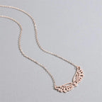 Collar con gran dije de alas de ángel oro rosa
