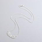 Collar con gran dije de alas de ángel plateado